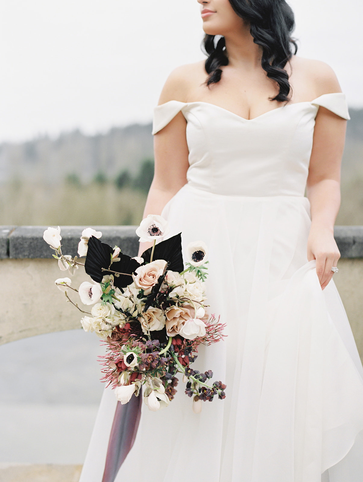 Chateau-Lill-Wedding-Bride-Leaning-on-Balcony.jpg The bride holding her bouquet and leaning on the balcony at Chateau Lill