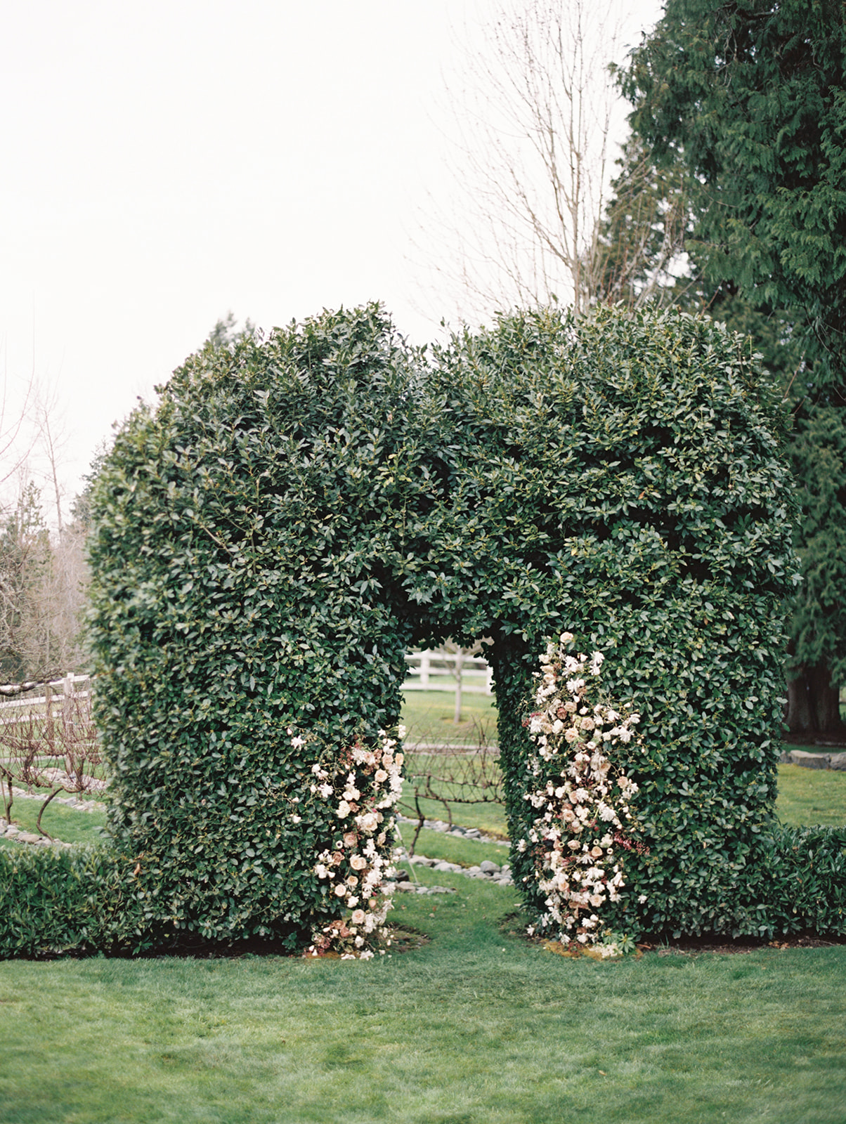 Chateau-Lill-Wedding-Garden-Hedge-with-Flowers.jpg A wide shot of the garden hedge with flowers at Chateau Lill