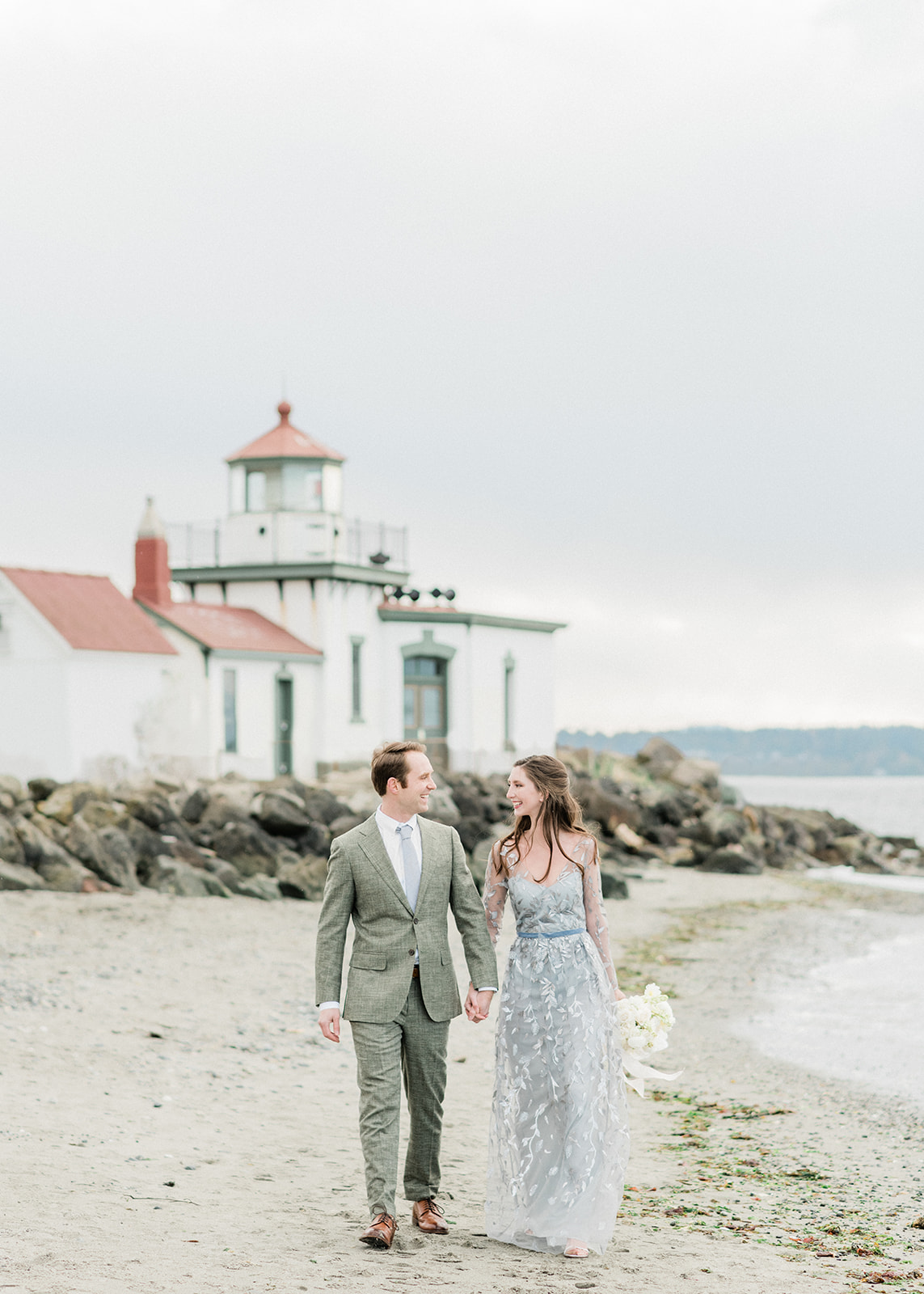 Discovery-Park-Elopement-Lighthouse.jpg Discovery Park lighthouse in distance with couple walking
