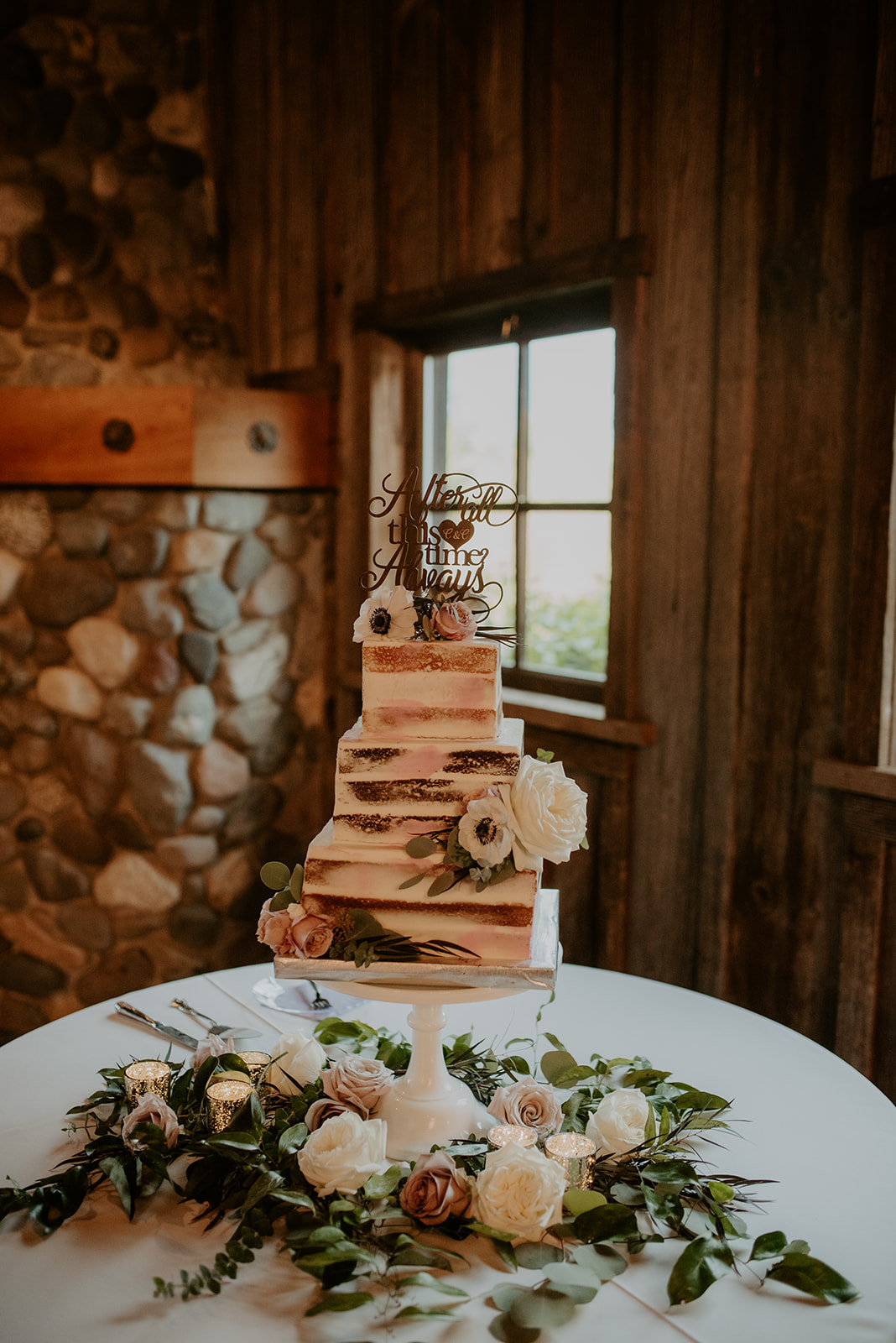 Kelley-Farm-Wedding-Cake-Table.jpg Naked cake decorated with flowers