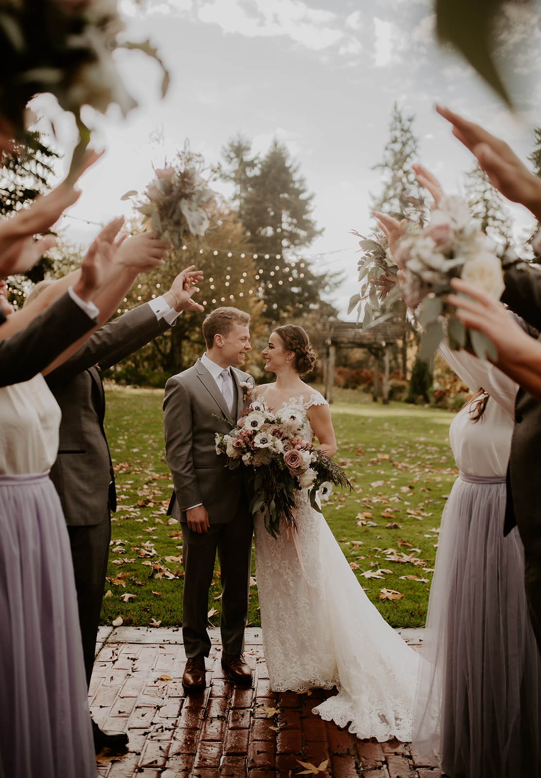 Kelley-Farm-Wedding-Walking-Through-Party.jpg The bride and groom walking through the wedding party