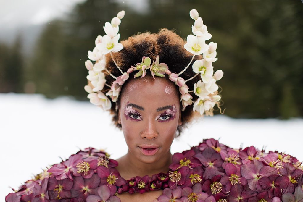 Seattle-Wedding-Florist-Bloom-Poet-Couture-Flower-Dress-American-Flowers-Week-2021-Headpiece A model with a couture headpiece and hellebore dress looks directly into the camera