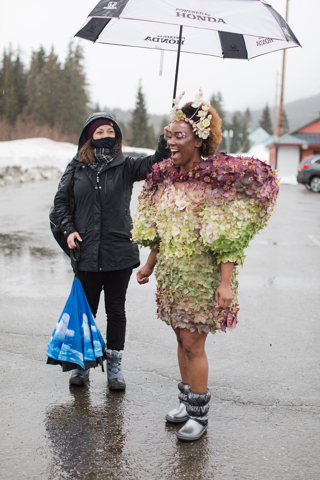 Hellebore grower Pamela on the left, holding an umbrella for our model Tasia, on the right