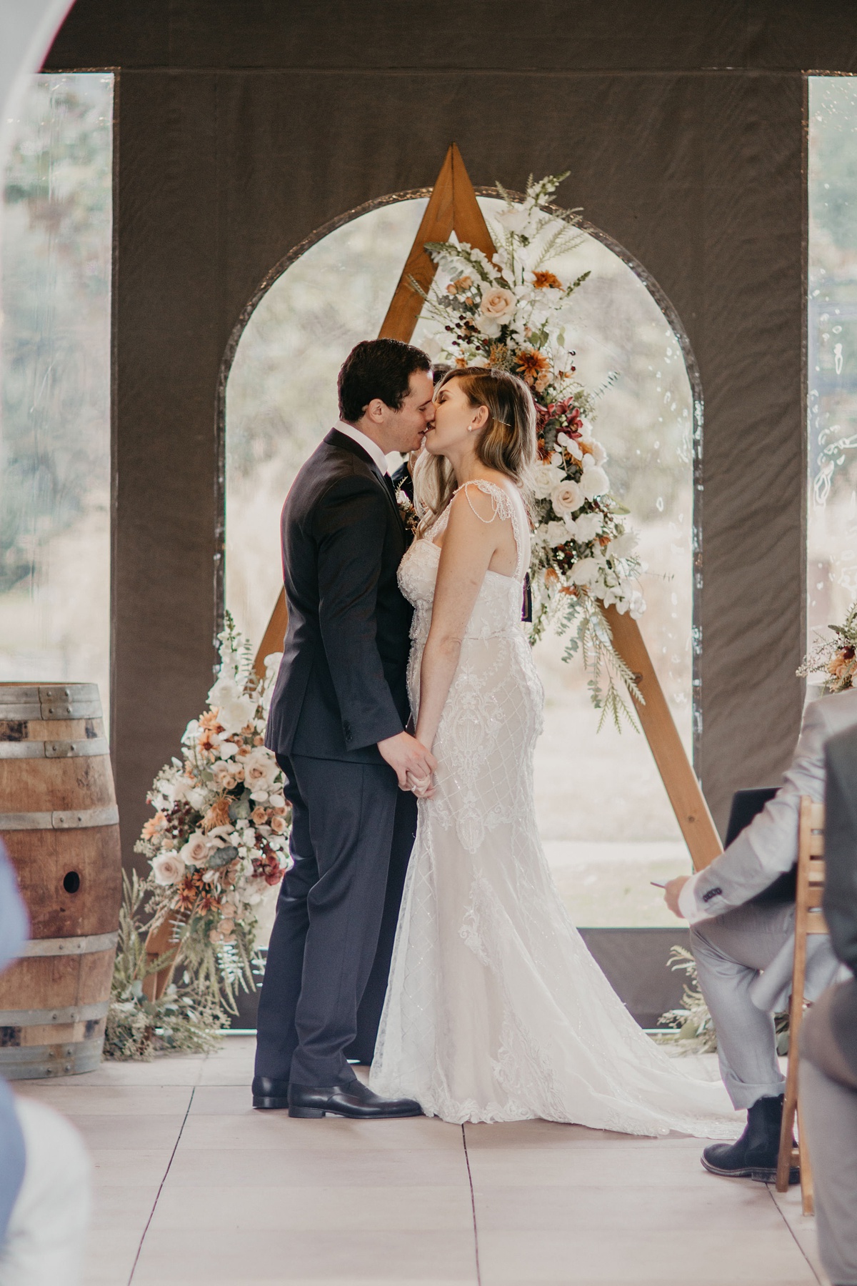 Willows-Lodge-Wedding-Ceremony-Kiss-Garden-Gazebo-Tent the couples first kiss at the garden gazebo tent, in front of their ceremony arch