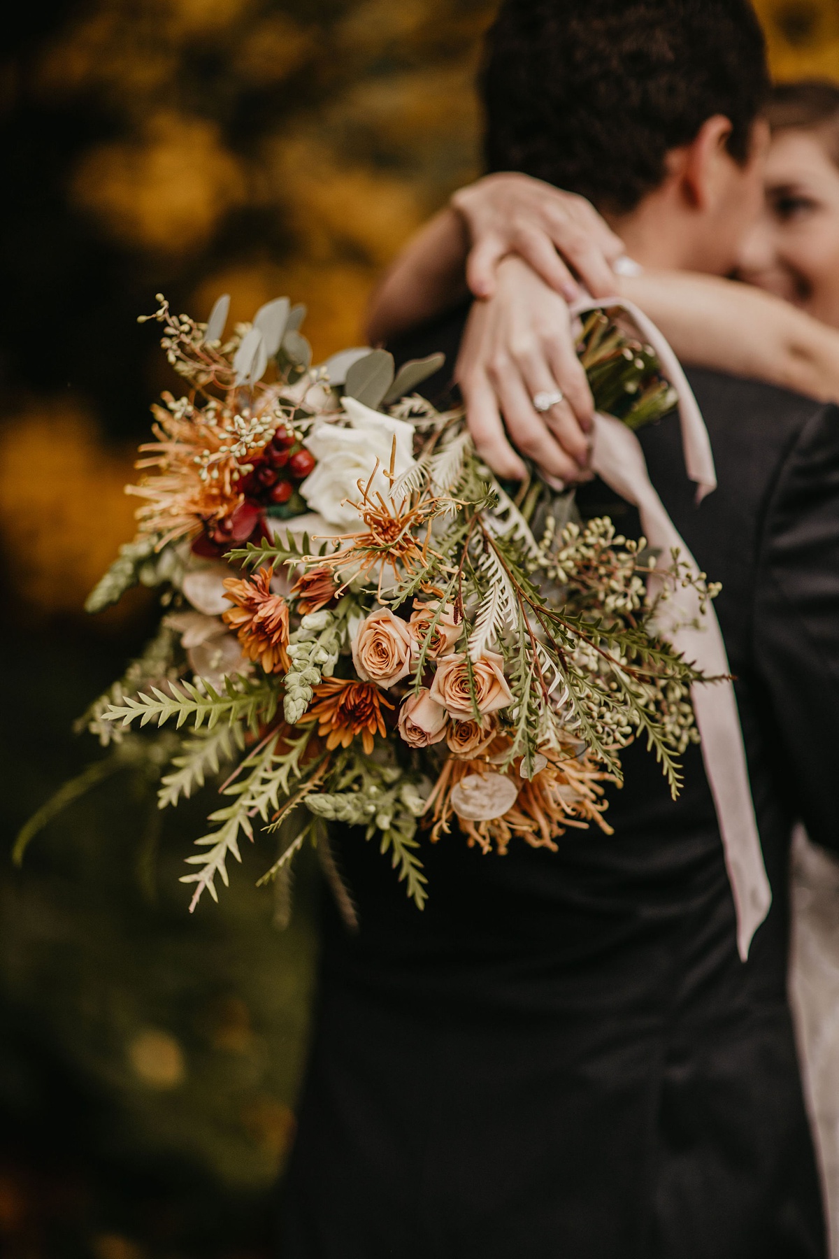 Willows-Lodge-Wedding-Fall-Wedding-Bouquet a seasonal wequet with roses, heirloom mums, grevillea foliage, and orchidsdding bou