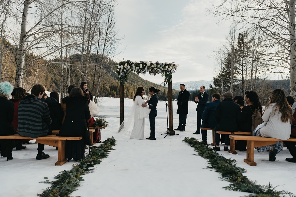 The couple standing at their wedding ceremony