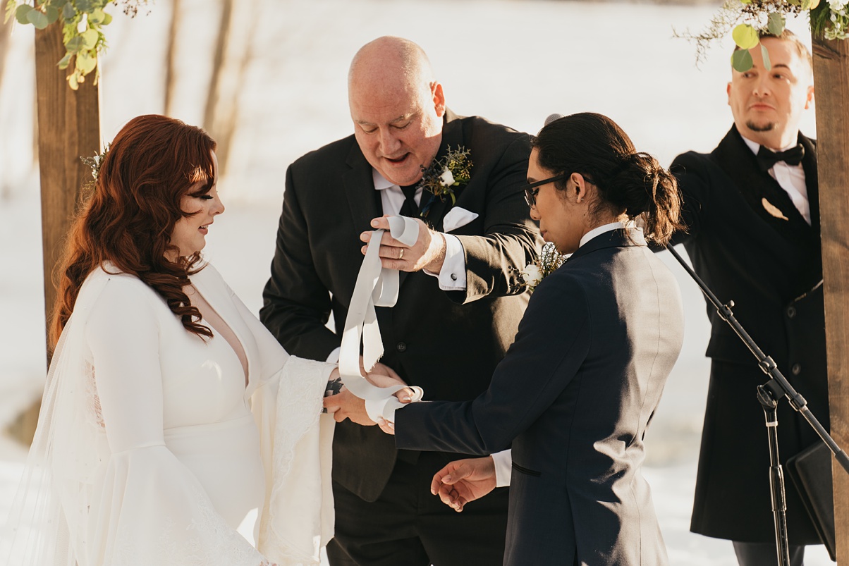 The beginning of the handfasting ceremony with hand-dyed silk ribbon