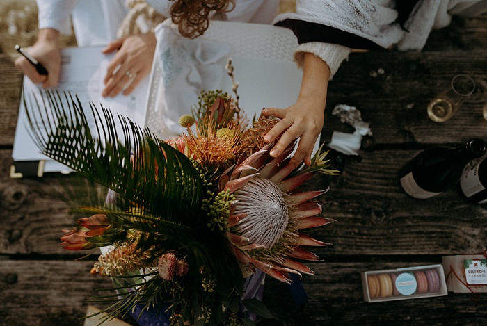 The bride and groom signing their marriage certificate