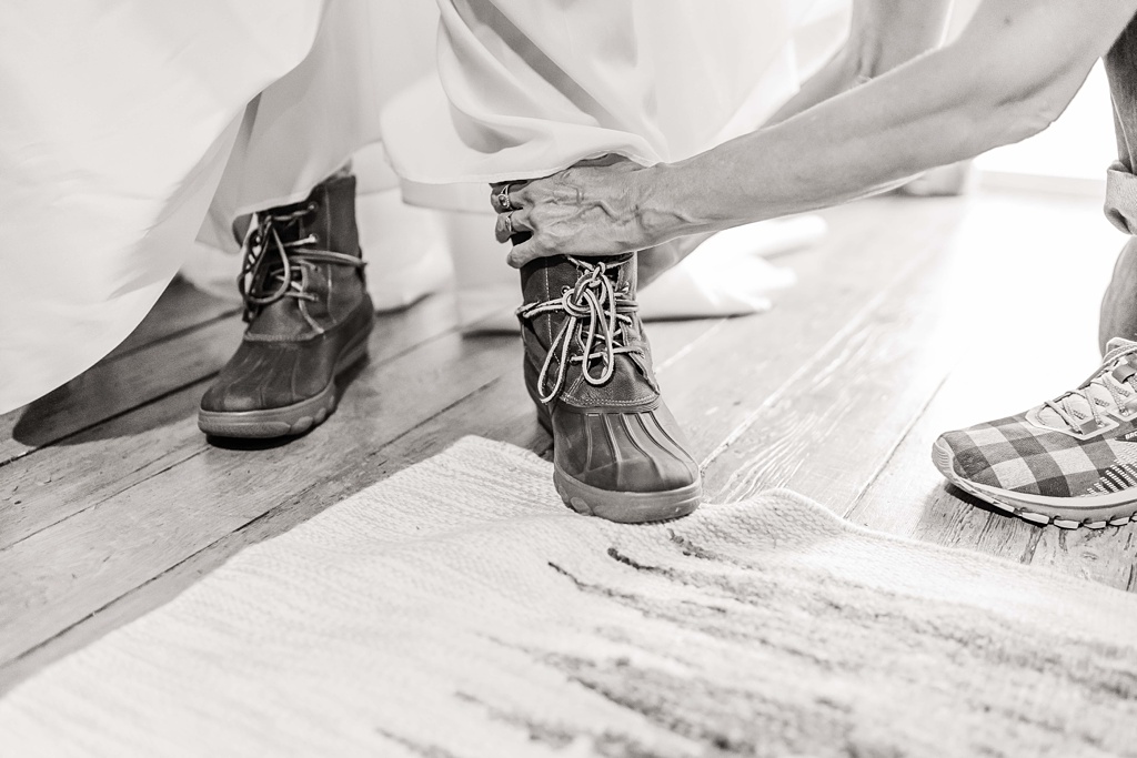 Mountain-Wedding-with-Vibrant-Summer-Blooms-Duck-Boots The bride's smart choice of footwear for hiking in a wedding dress!