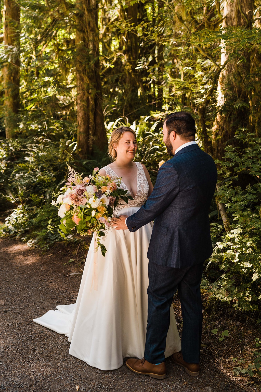 Mountain-Wedding-with-Vibrant-Summer-Blooms-Holding-Bouquet The bride holding her bouquet