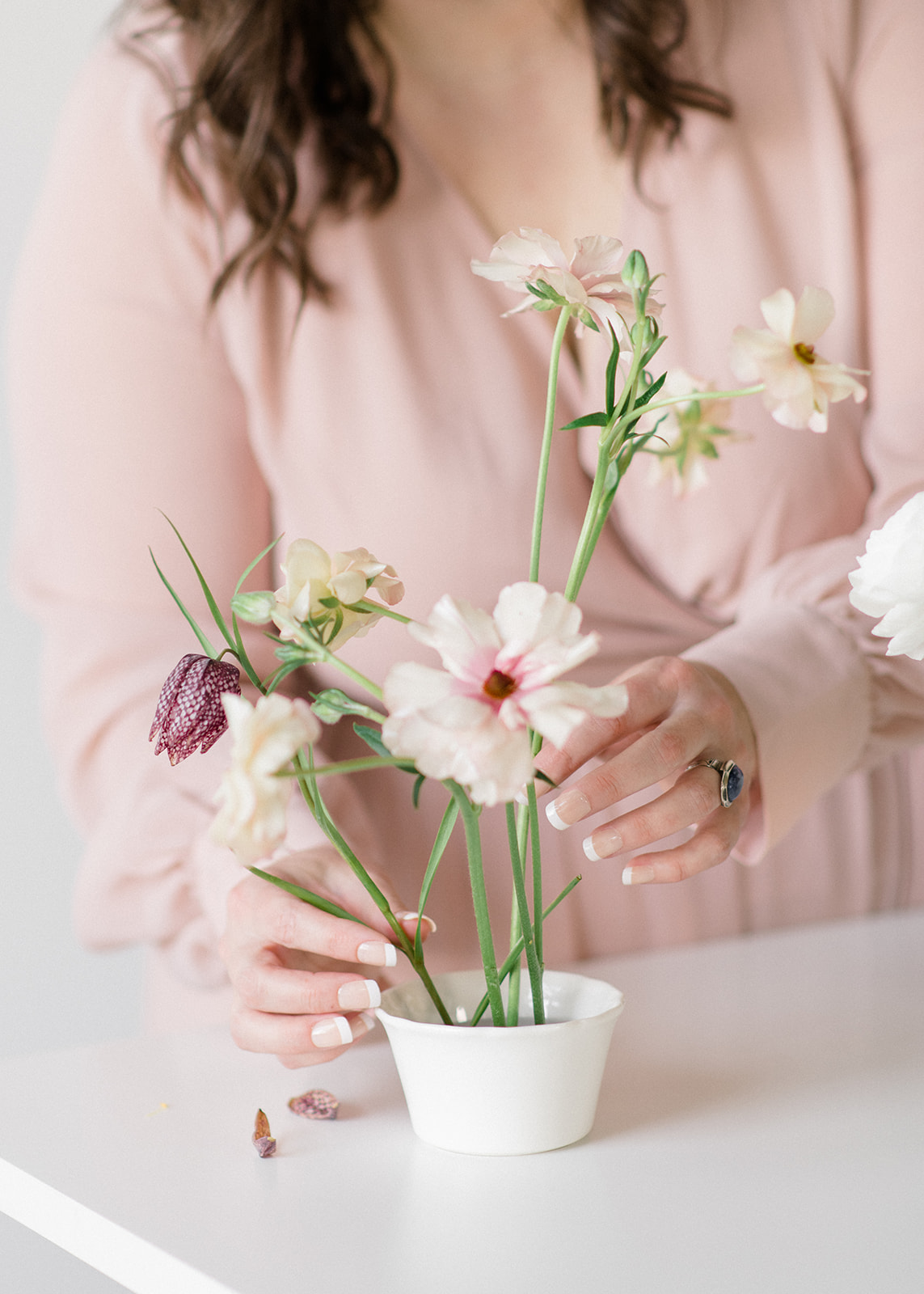 Bloom-Poet-Seattle-Wedding-Florist-Work-With-Us-Arranging-Flowers Owner Carolyn Kulb arranging blush flowers