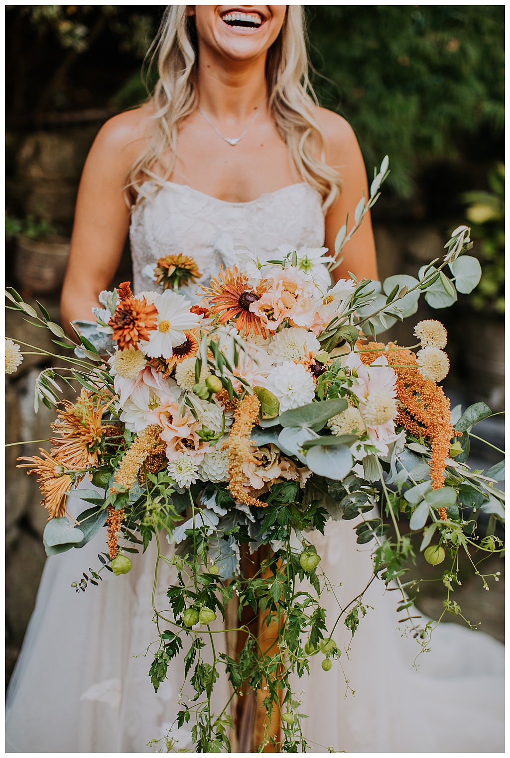 Seattle-Wedding-Florist-Bloom-Poet-Fall-Wedding-Boho-Flowers-Cascading-Bouquet-Foliage A view of the cascading wedding bouquet