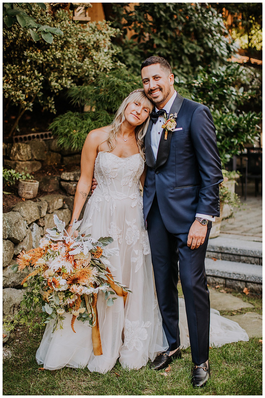 Seattle-Wedding-Florist-Bloom-Poet-Fall-Wedding-Boho-Flowers-Couple-with-Bouquet The couple posing, close to each other, with the bride holding the bouquet
