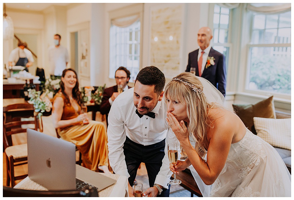 Seattle-Wedding-Florist-Bloom-Poet-Fall-Wedding-Boho-Flowers-Zoom-Wedding The couples blow kisses to their wedding attendees via zoom