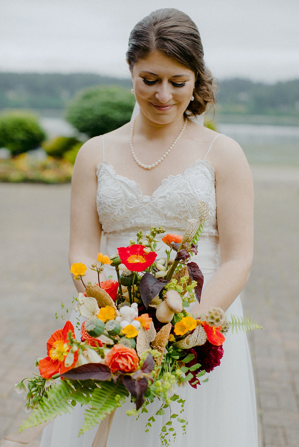 Bloom-Poet-Seattle-Wedding-Florist-Kiana-Lodge-Wedding-Bouquet-Details A bride holding her wedding bouquet at Kiana Lodge