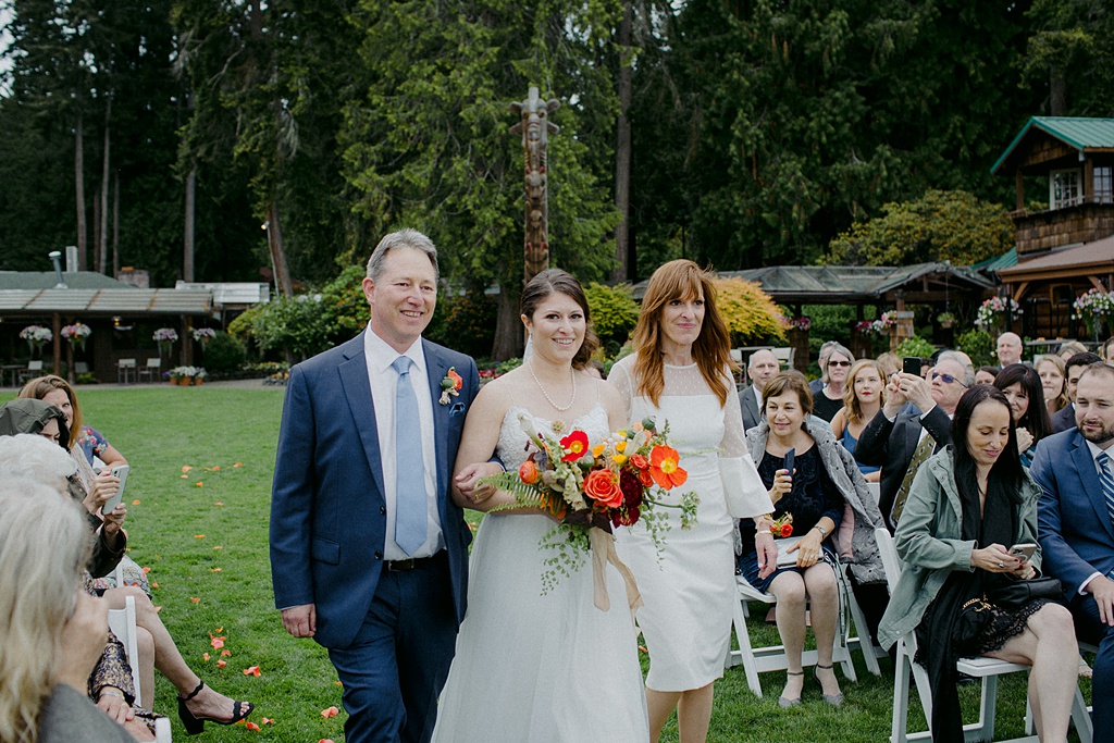 Bloom-Poet-Seattle-Wedding-Florist-Kiana-Lodge-Wedding-Bride-Walking The bride is walked down the aisle at this Kiana Lodge wedding