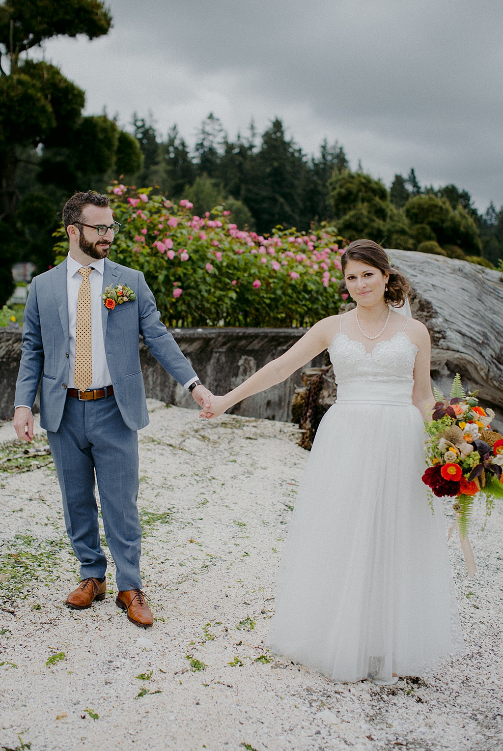 Bloom-Poet-Seattle-Wedding-Florist-Kiana-Lodge-Wedding-Couple A couple standing at Kiana Lodge holding hands