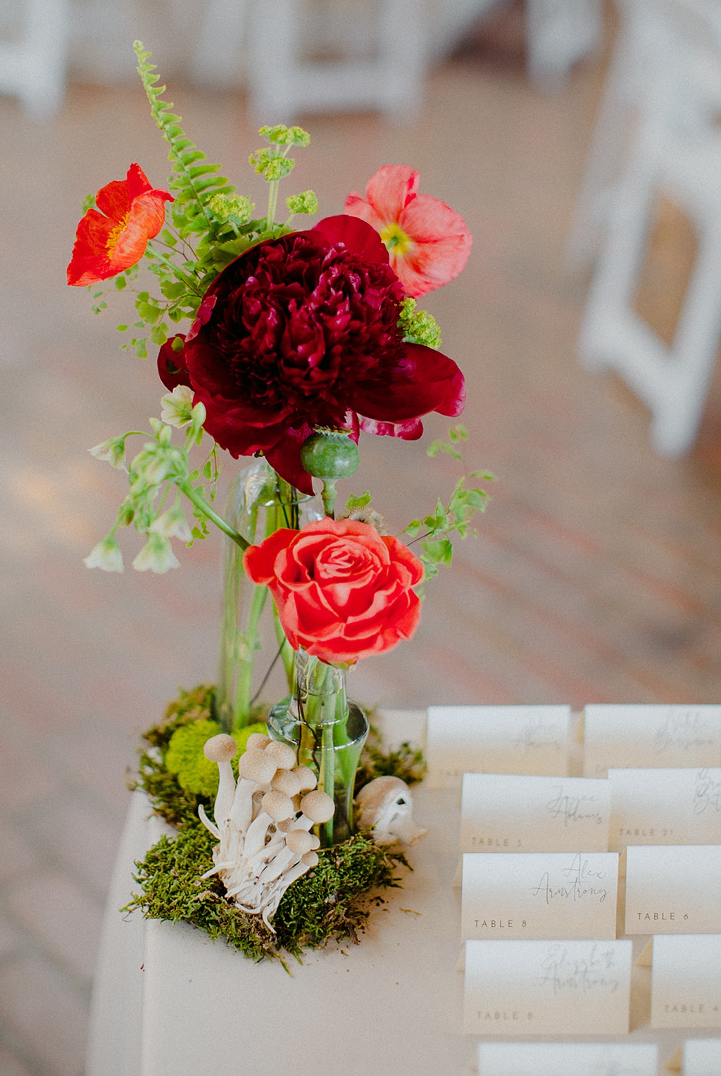 Bloom-Poet-Seattle-Wedding-Florist-Kiana-Lodge-Wedding-Escort-Cards A peony arrangement at the escort card table at Kiana Lodge