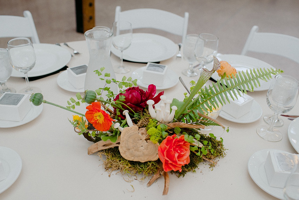 Bloom-Poet-Seattle-Wedding-Florist-Kiana-Lodge-Wedding-Mushroom-Florals A wedding centerpiece with mushrooms and roots