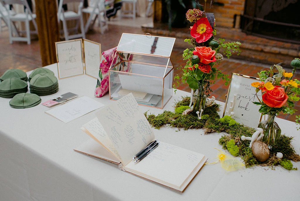 Bloom-Poet-Seattle-Wedding-Florist-Kiana-Lodge-Wedding-Welcome-Florals Welcome table with florals and mushrooms