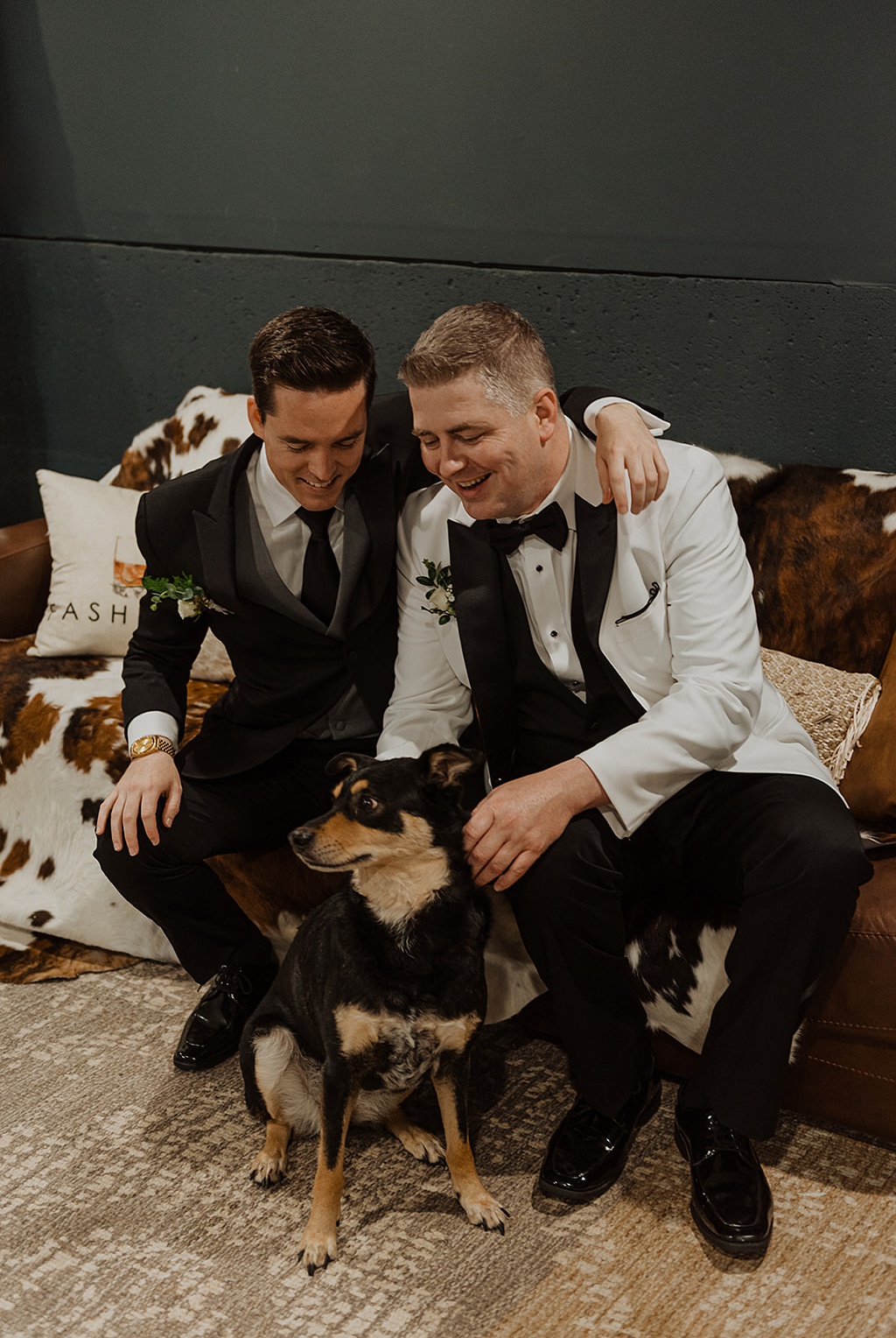 A wedding portrait of the gay couple and their dog