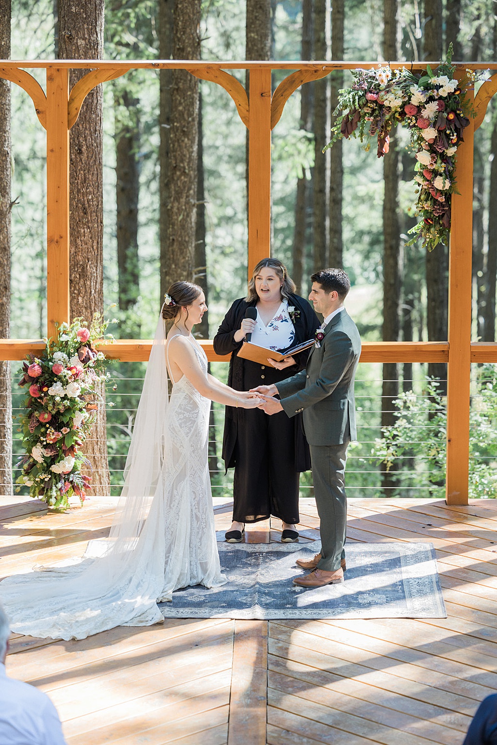 Bloom-Poet-Seattle-Wedding-Florist-Tierra-Retreat-Center-Wedding-Ceremony-Flowers Wedding ceremony flowers at the Tierra Retreat Center with couple holding hands