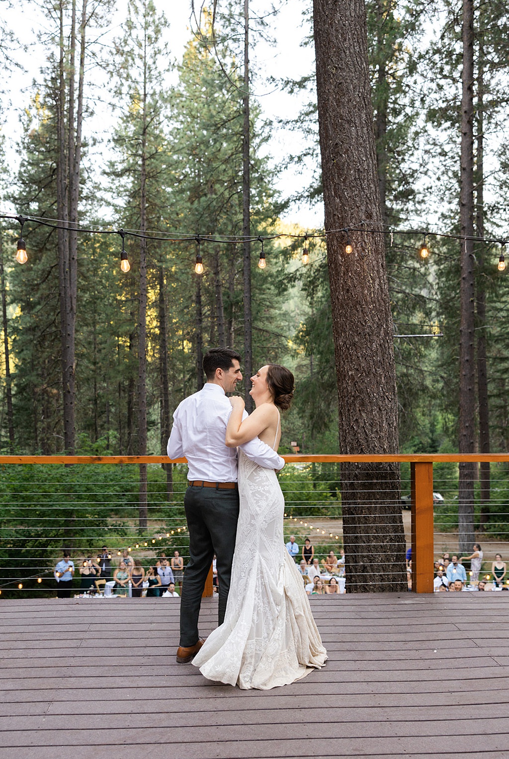 Bloom-Poet-Seattle-Wedding-Florist-Tierra-Retreat-Center-Wedding-First-Dance The first dance at the wedding reception, with pines in the background