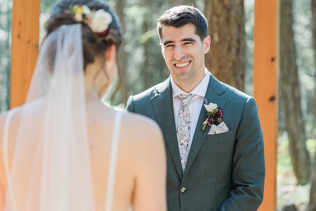 Bloom-Poet-Seattle-Wedding-Florist-Tierra-Retreat-Center-Wedding-Groom The groom looks on to his bride lovingly during the wedding ceremony at Tierra Retreat Center