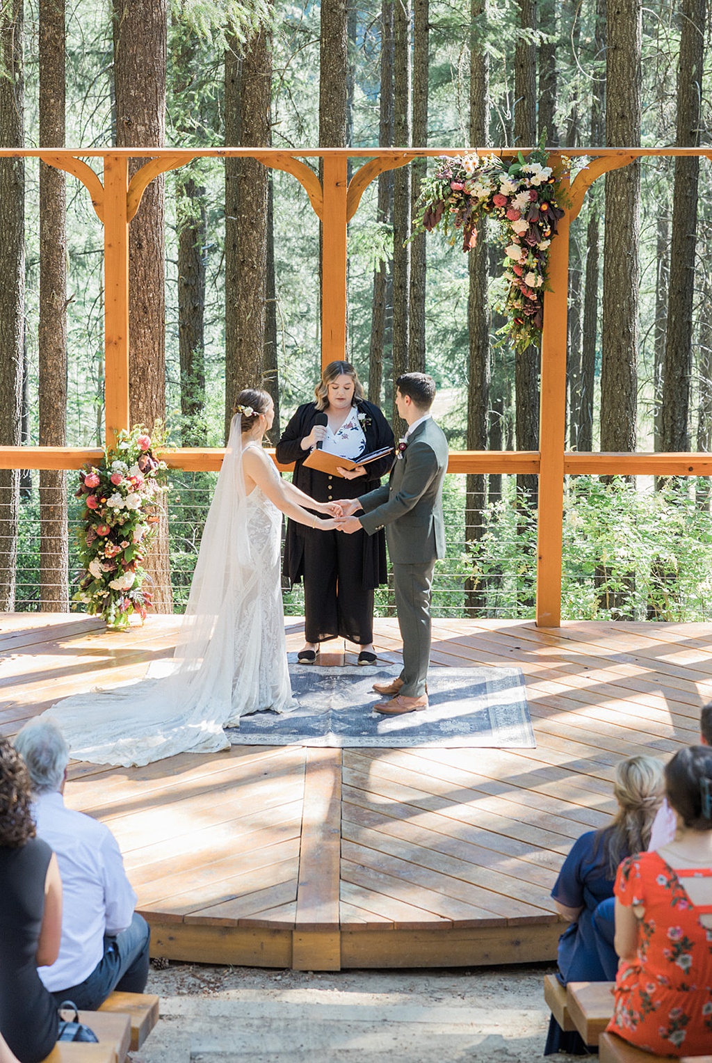 Bloom-Poet-Seattle-Wedding-Florist-Tierra-Retreat-Center-Wedding_Ceremony Wedding florals and wooden platform for the wedding ceremony at Tierra Retreat Center